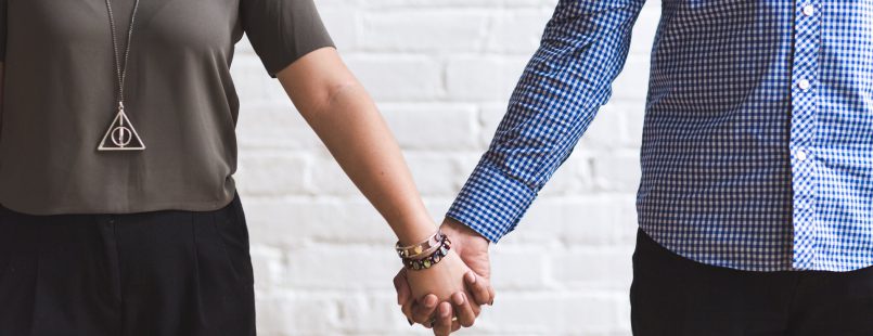 man and woman holding hands