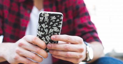 man reading online dating tips for guys